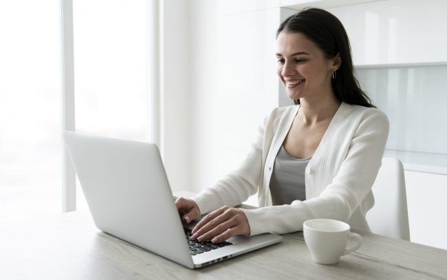 woman-laptop2-fp Woman in business attire working on laptop illustrates blog "Commercial Property Insurance: What You Need To Know"