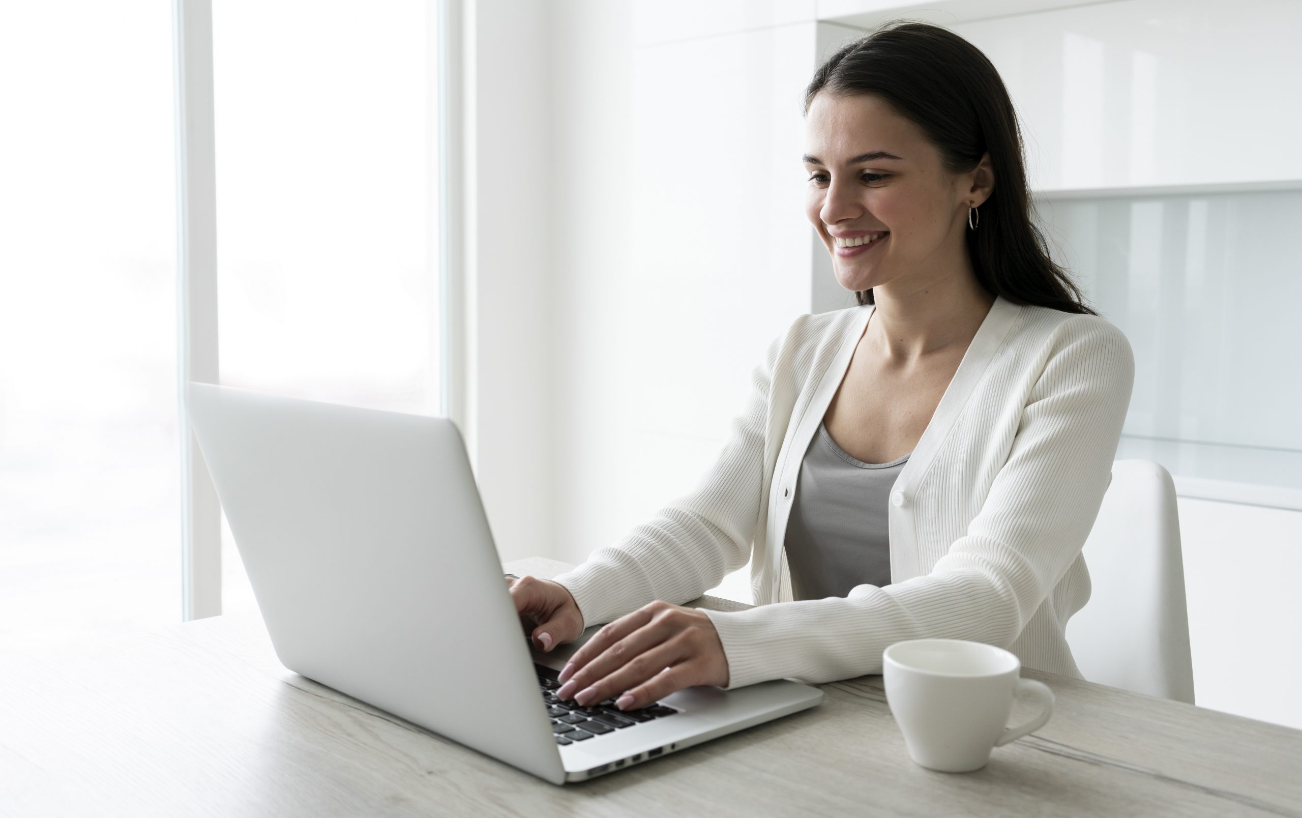 woman-laptop2-fp Woman in business attire working on laptop illustrates blog "Commercial Property Insurance: What You Need To Know"