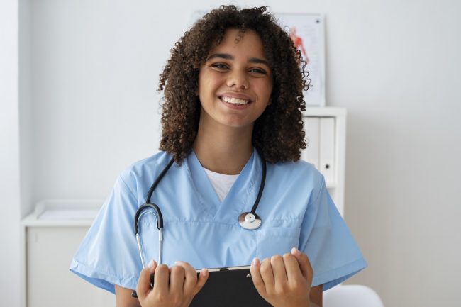 female-nurse-fp Nurse holding clipboard.