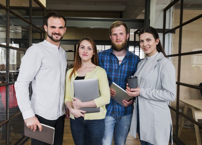 business-owners-casual-freepik Group of casual business owners illustrates blog "Customizing Your Coverage: Endorsements and Riders in Business Property Insurance"