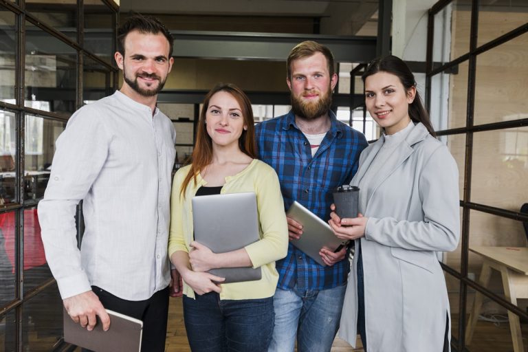 Group of casual business owners illustrates blog "Customizing Your Coverage: Endorsements and Riders in Business Property Insurance"