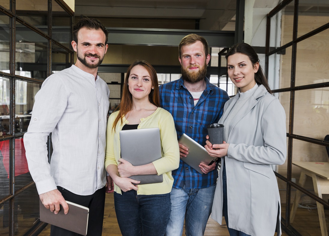 business-owners-casual-freepik Group of casual business owners illustrates blog "Customizing Your Coverage: Endorsements and Riders in Business Property Insurance"