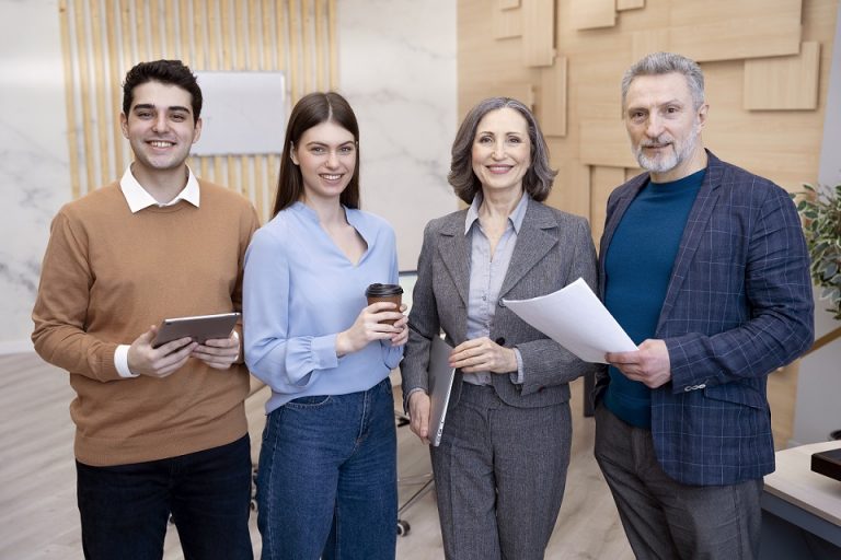 Four professionals dressed casually.
