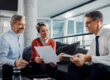 insurance agent reviewing annual policy with client