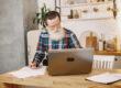 Remote worker reviewing home business insurance needs in a home office