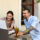 Couple reviewing health insurance plans and employee benefits to avoid costly open enrollment mistakes.