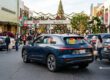 Does auto insurance cover theft? Car parked at a shopping center during the holiday season with shopping bags inside.